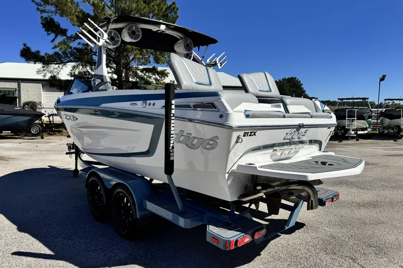 Slide: The Image of 2021 Tigé 21ZX boat on trailer, featuring sleek design and modern amenities. - 5