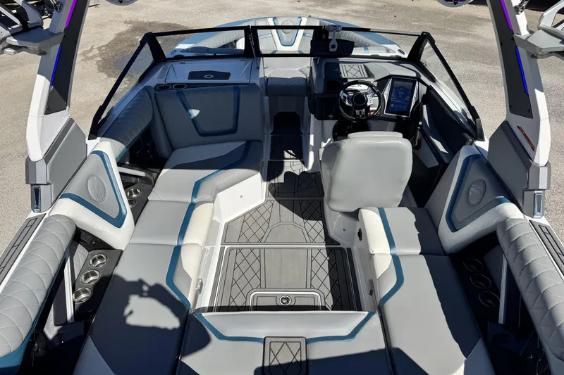 Slide: The Image of 2021 Tigé 21ZX boat interior with modern seating and sleek dashboard design. - 7