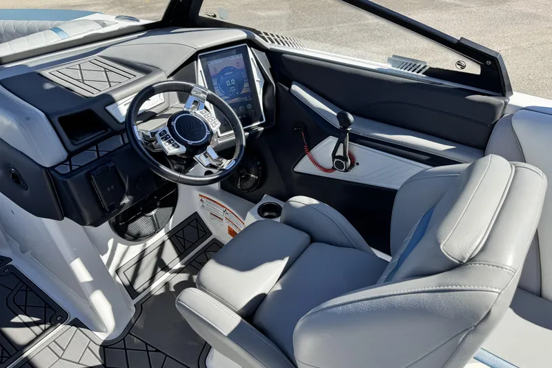 Slide: The Image of 2021 Tigé 21ZX boat interior with modern dashboard and steering wheel. - 9
