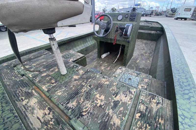 Slide: The Image of 2016 Custom Charles Leonard Skiff with camouflage interior and steering console. - 19