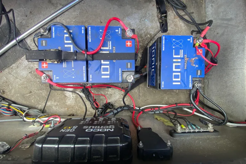 Slide: The Image of Batteries and wiring setup in a 2016 Custom Charles Leonard Skiff boat. - 21