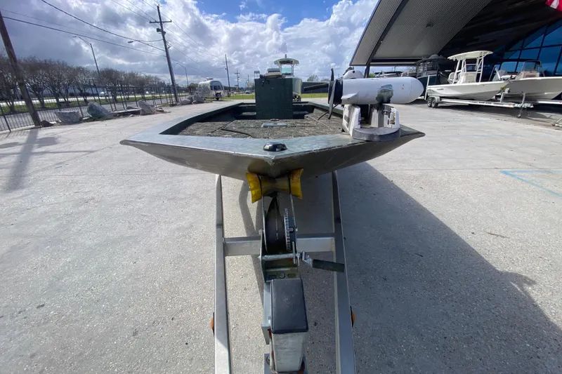 Slide: The Image of Custom 2016 Charles Leonard Skiff on trailer, parked outdoors under cloudy sky. - 8