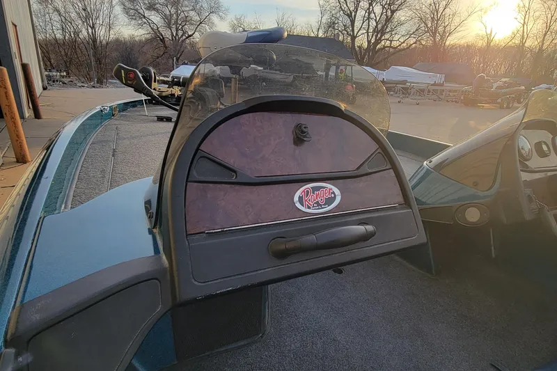 Slide: The Image of 2001 Ranger 518DVX Comanche boat dashboard with sunset background. - 8
