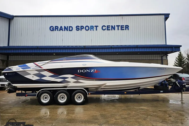The Image of 2000 Donzi 33 ZX speedboat on trailer at Grand Sport Center. - 1