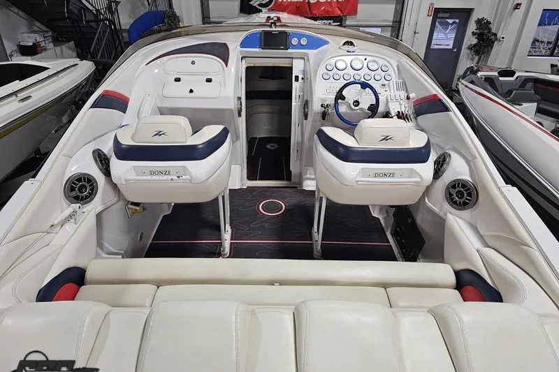 Slide: The Image of Interior of a 2000 Donzi 33 ZX boat with white and blue seating. - 37