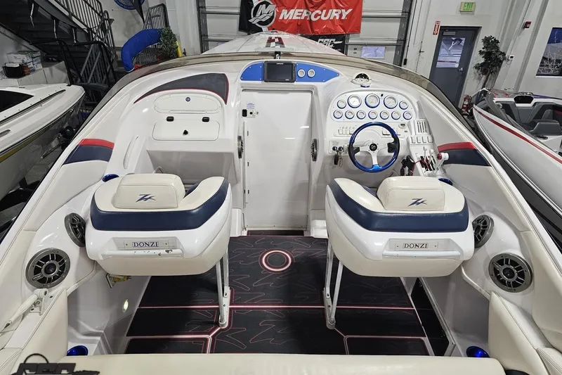 Slide: The Image of 2000 Donzi 33 ZX boat interior with dual seats and control panel. - 38