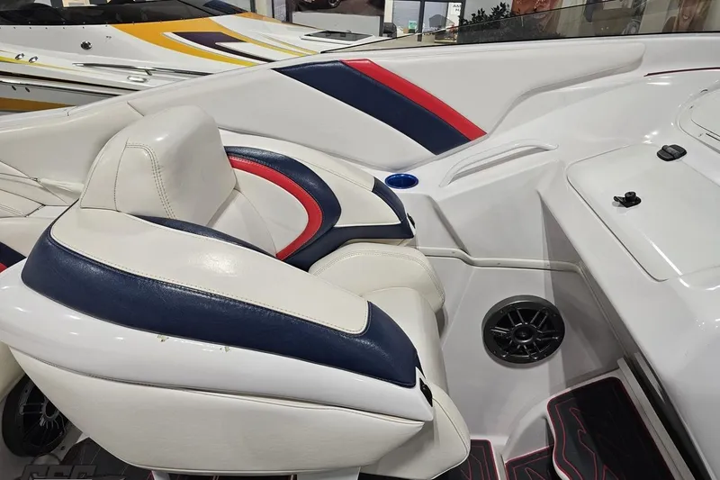 Slide: The Image of 2000 Donzi 33 ZX boat interior with white, blue, and red seating. - 46