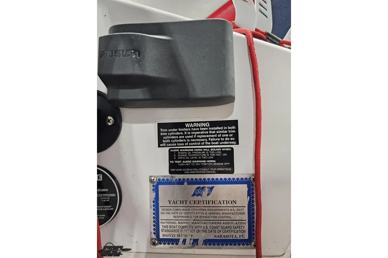 Slide: The Image of 2000 Donzi 33 ZX yacht certification and warning labels on boat interior. - 54