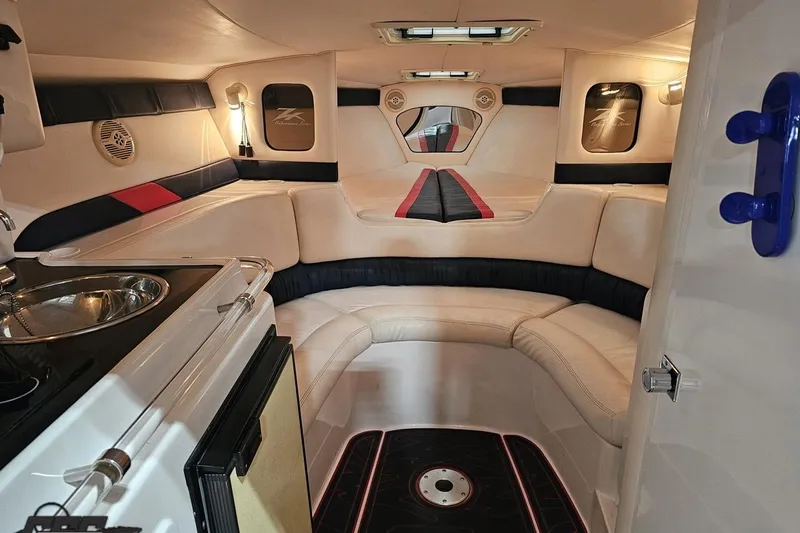 Slide: The Image of Luxurious interior of a 2000 Donzi 33 ZX boat with seating and kitchenette. - 59