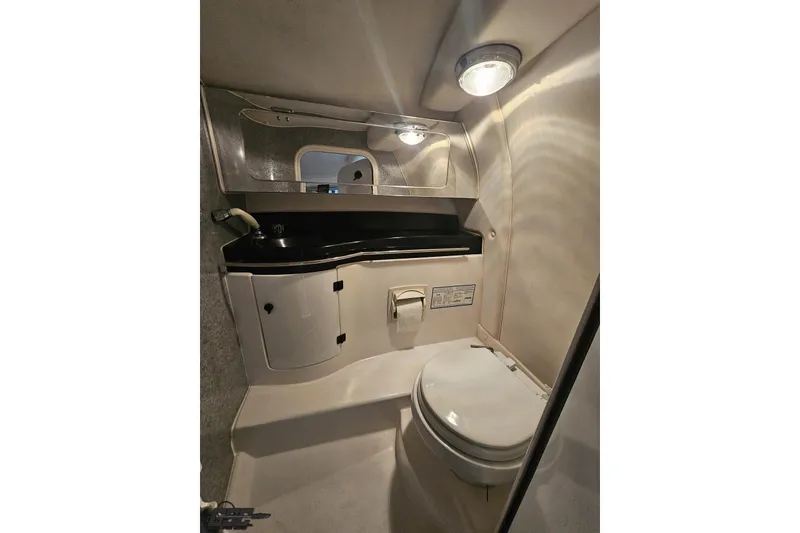 Slide: The Image of 2000 Donzi 33 ZX boat bathroom interior with sink, mirror, and toilet. - 71