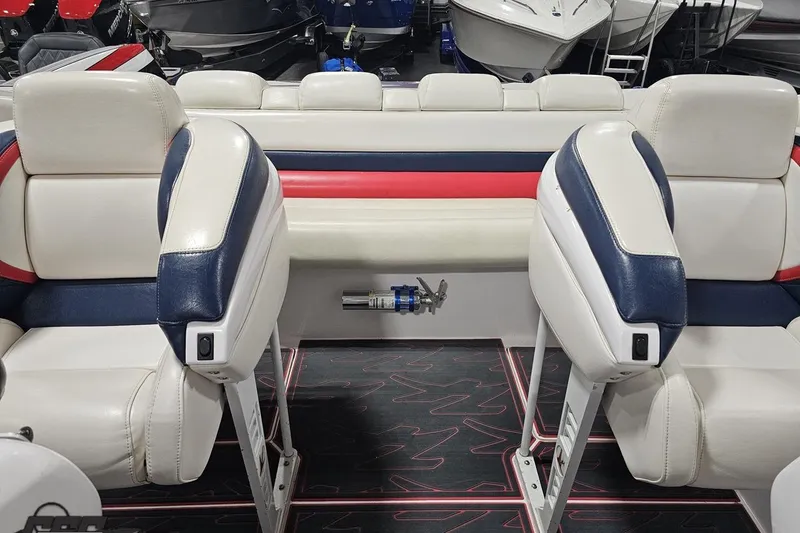 Slide: The Image of Interior of a 2000 Donzi 33 ZX boat with white, blue, and red seating. - 75