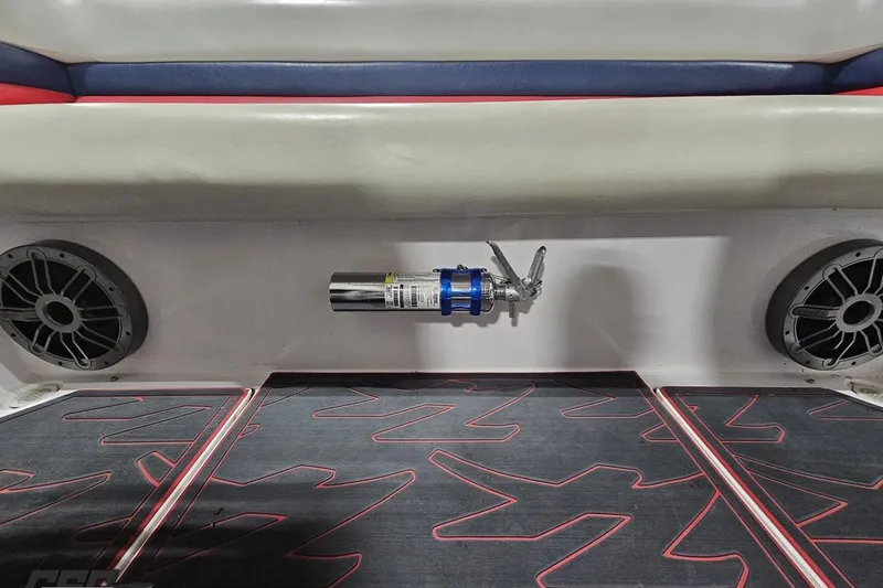 Slide: The Image of Interior of 2000 Donzi 33 ZX boat with speakers and fire extinguisher. - 80