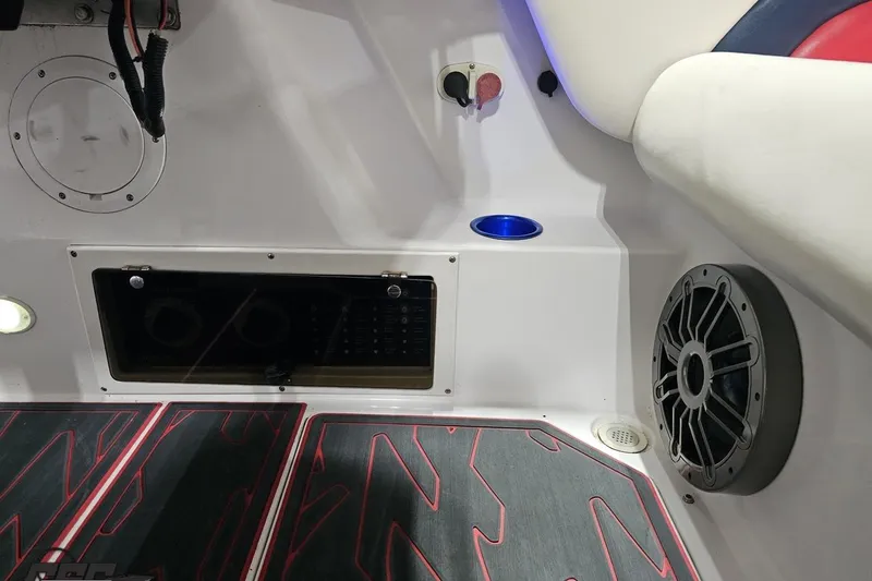 Slide: The Image of Interior of a 2000 Donzi 33 ZX boat featuring speaker and control panel. - 83