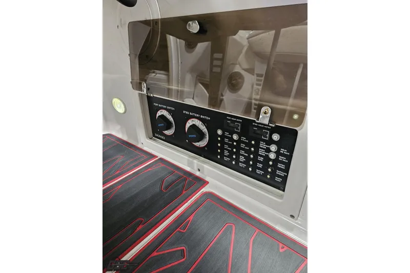 Slide: The Image of Control panel of a 2000 Donzi 33 ZX boat with battery switches and hour meters. - 84