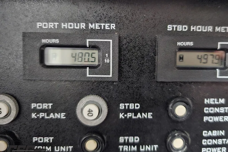 Slide: The Image of Control panel of a 2000 Donzi 33 ZX boat showing port and starboard hour meters. - 85