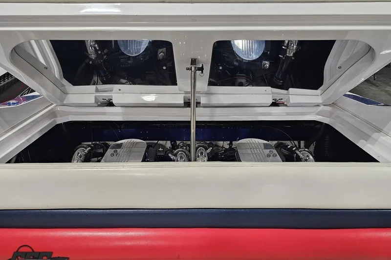 Slide: The Image of Engine compartment of a 2000 Donzi 33 ZX boat, showcasing dual engines. - 88