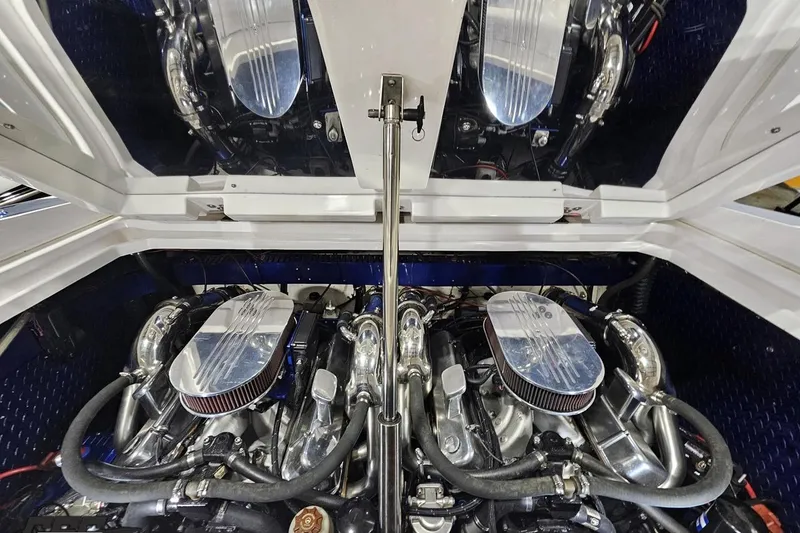 Slide: The Image of Engine compartment of a 2000 Donzi 33 ZX boat, showcasing dual engines. - 89