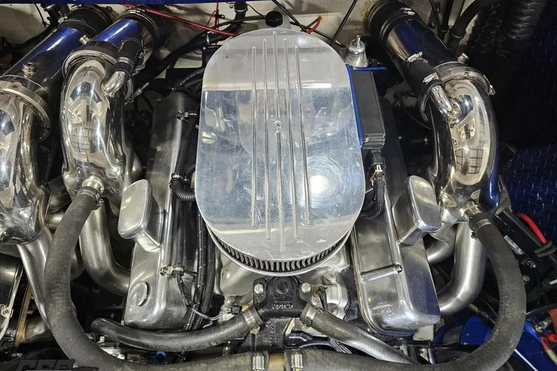 Slide: The Image of Engine of a 2000 Donzi 33 ZX boat, featuring polished metal components. - 93