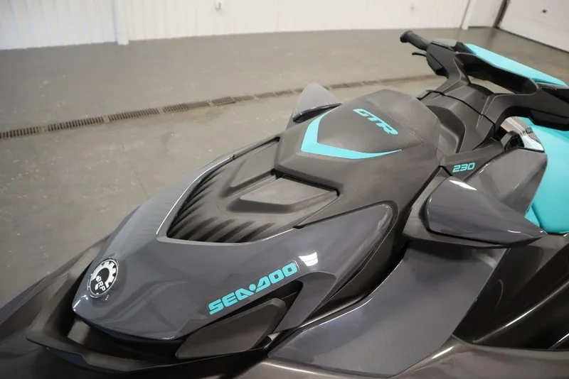 Slide: The Image of 2025 Sea-Doo GTR 230 jet ski, sleek design, gray and teal accents. - 11