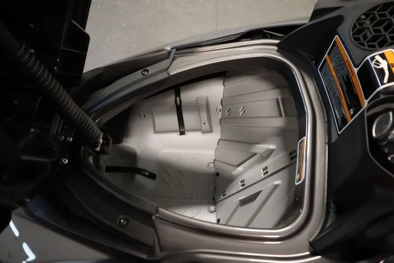 Slide: The Image of 2025 Sea-Doo GTR 230 storage compartment, open view, showcasing interior design. - 13