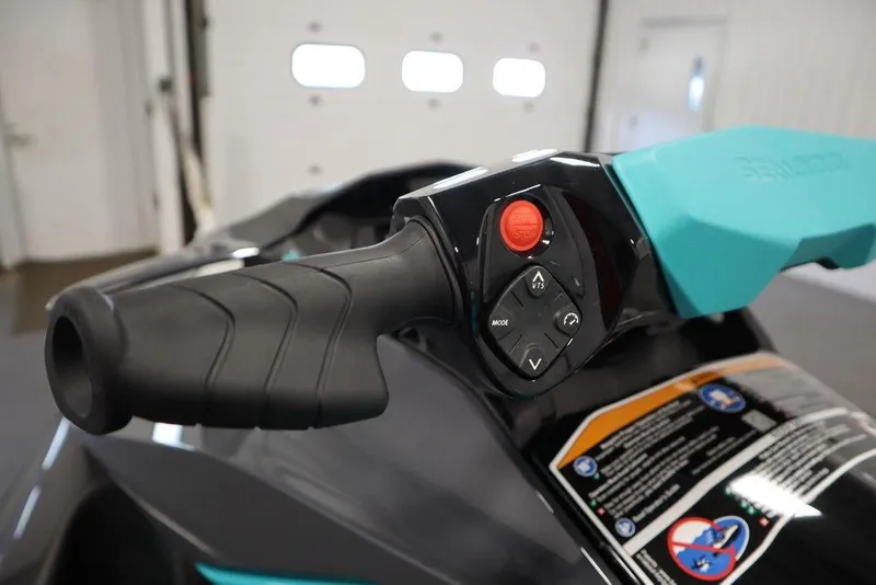 Slide: The Image of 2025 Sea-Doo GTR 230 handlebar controls in a garage setting. - 14