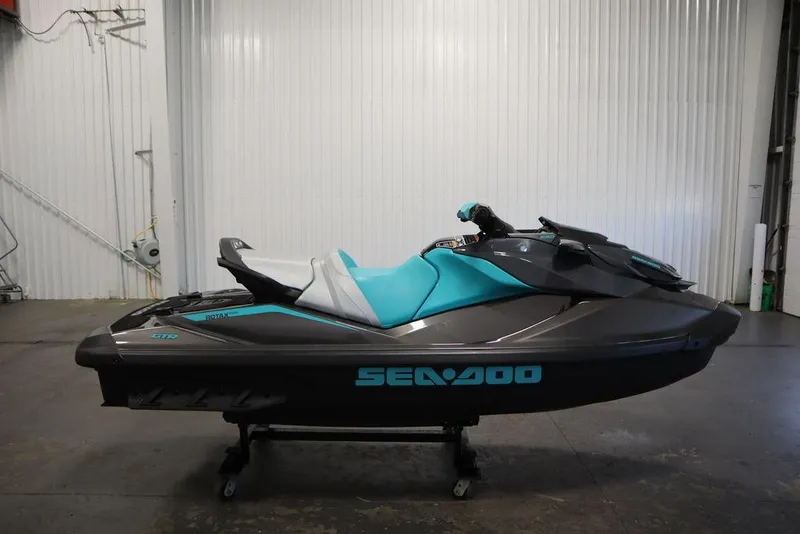 Slide: The Image of 2025 Sea-Doo GTR 230 jet ski in a garage, side view. - 6