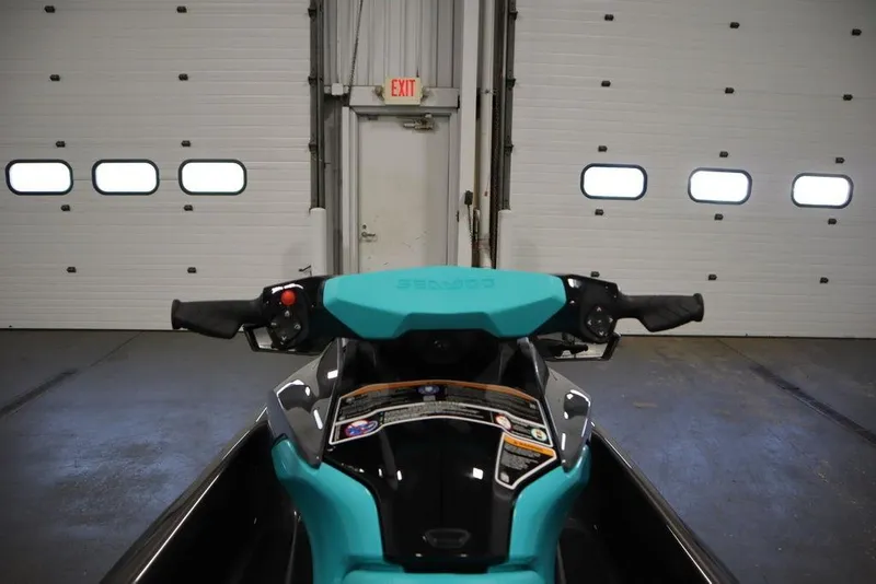 Slide: The Image of 2025 Sea-Doo GTR 230 handlebars in a garage setting. - 8