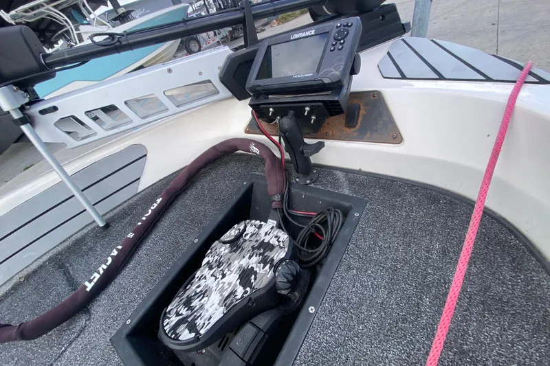 Slide: The Image of 2002 Skeeter SL 190 boat interior with Lowrance fish finder and camo foot pedal. - 11