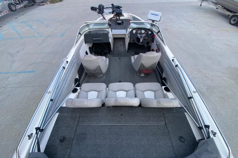 Slide: The Image of 2002 Skeeter SL 190 boat interior with seating and steering console. - 13