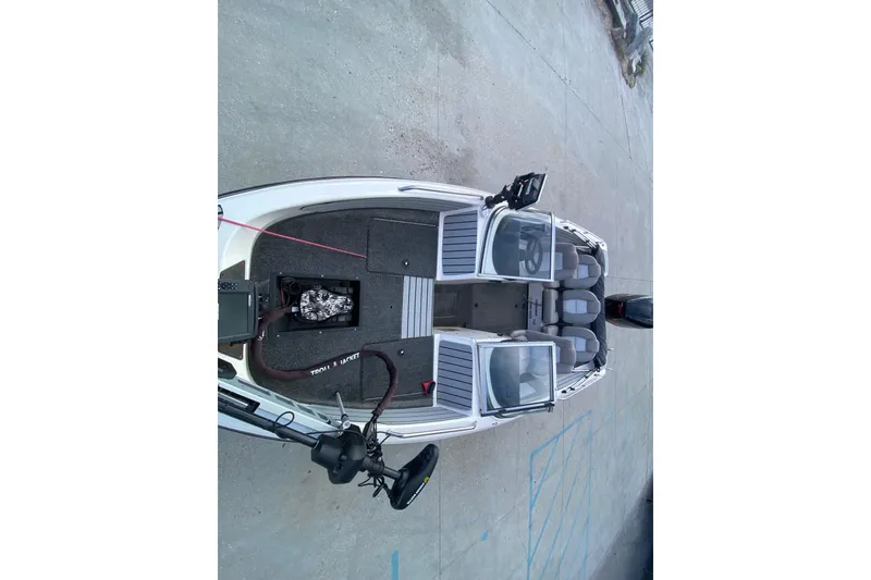 Slide: The Image of Overhead view of a 2002 Skeeter SL 190 boat on concrete surface. - 21