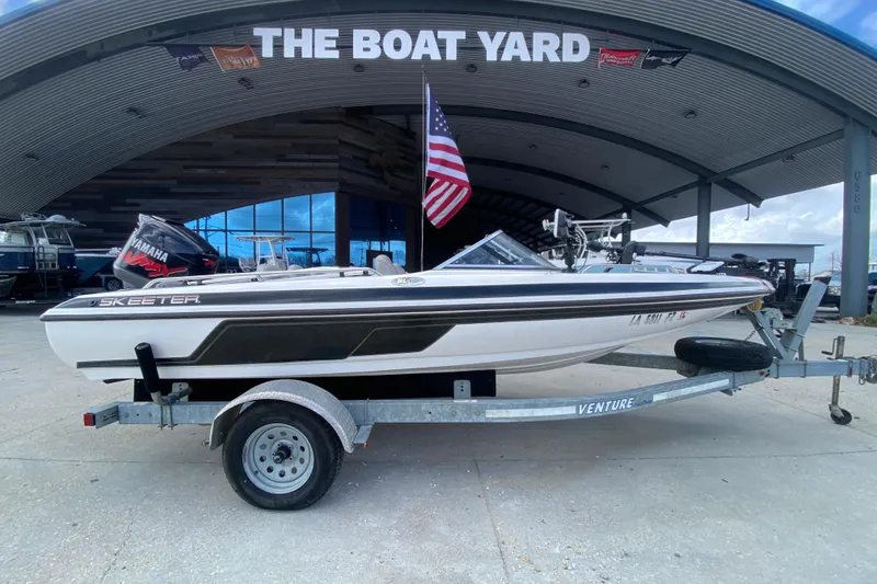 Slide: The Image of 2002 Skeeter SL 190 boat on trailer at The Boat Yard, featuring Yamaha engine. - 3
