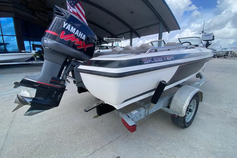 Slide: The Image of 2002 Skeeter SL 190 boat with Yamaha VMAX engine on a trailer. - 4