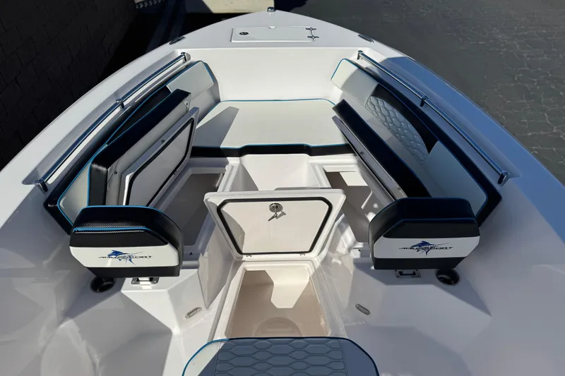Slide: The Image of 2024 Aquasport 2200 Center Console boat interior with seating and storage compartments. - 13