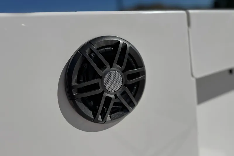 Slide: The Image of 2024 Aquasport 2200 Center Console boat speaker detail in sunlight. - 19