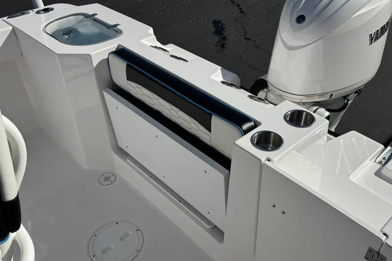 Slide: The Image of 2024 Aquasport 2200 Center Console boat with seating, cup holders, and Yamaha engine. - 21
