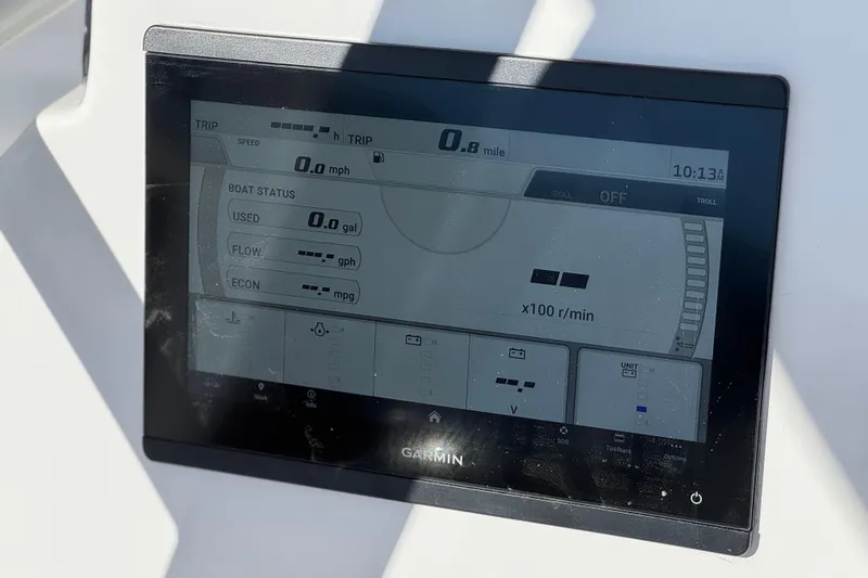 Slide: The Image of Garmin display on 2024 Aquasport 2200 Center Console showing boat status and trip data. - 26