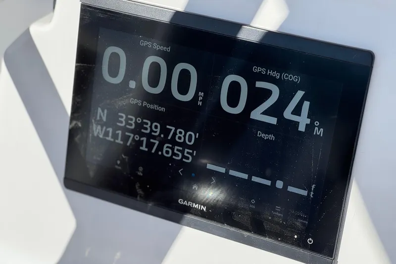 Slide: The Image of Garmin GPS display on 2024 Aquasport 2200 Center Console showing speed and coordinates. - 28