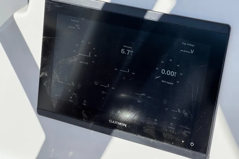 Slide: The Image of Garmin display on 2024 Aquasport 2200 Center Console showing odometer and GPS speed. - 29