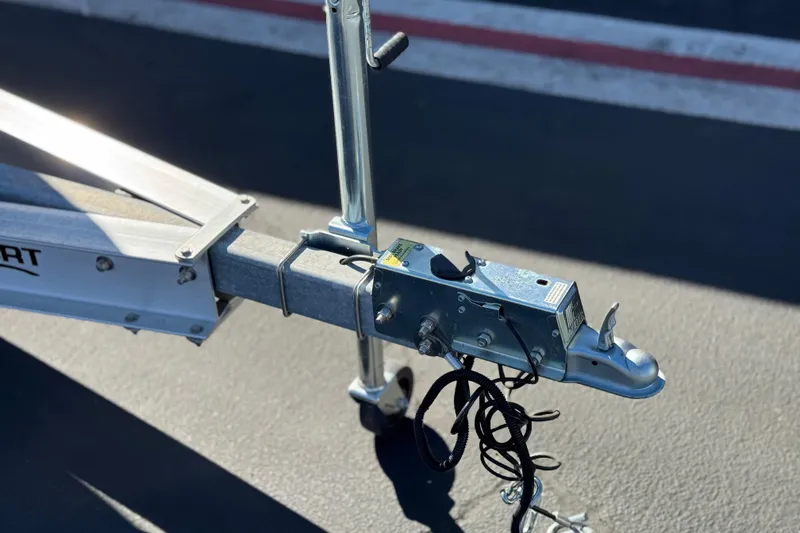 Slide: The Image of Trailer hitch of 2024 Aquasport 2200 Center Console on asphalt surface. - 34