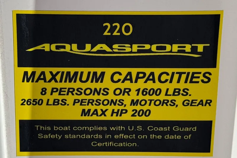 Slide: The Image of 2024 Aquasport 2200 Center Console capacity label, 8 persons, 1600 lbs, max HP 200. - 35