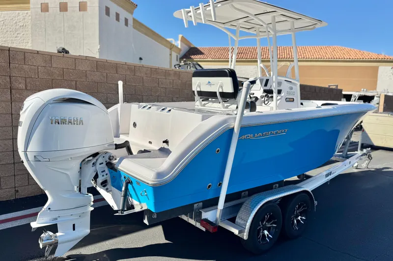 Slide: The Image of 2024 Aquasport 2200 Center Console boat with Yamaha engine on trailer. - 5