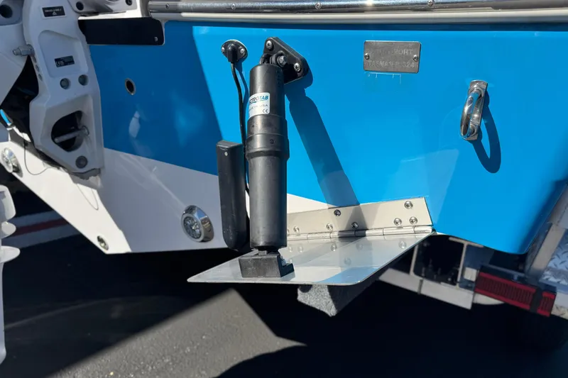 Slide: The Image of 2024 Aquasport 2200 Center Console boat with trim tab detail. - 8