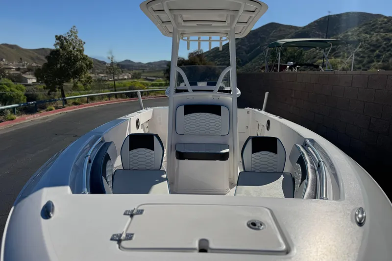 Slide: The Image of 2024 Aquasport 2200 Center Console boat with sleek design and modern seating. - 9