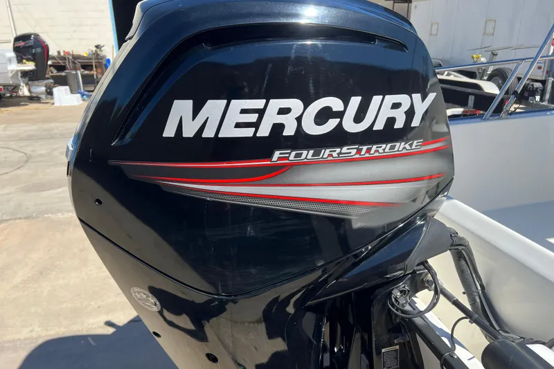 Slide: The Image of Mercury FourStroke engine on a 2016 Boston Whaler 170 Montauk boat. - 14