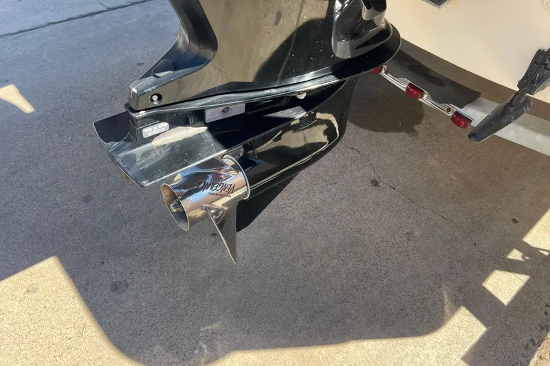 Slide: The Image of 2016 Boston Whaler 170 Montauk boat motor and propeller on concrete surface. - 16