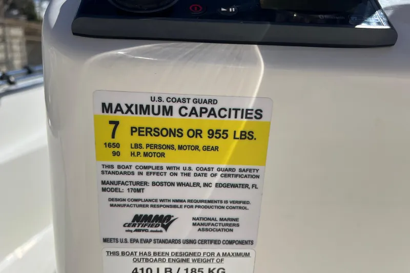Slide: The Image of 2016 Boston Whaler 170 Montauk capacity label, 7 persons or 955 lbs, 90 HP motor. - 19