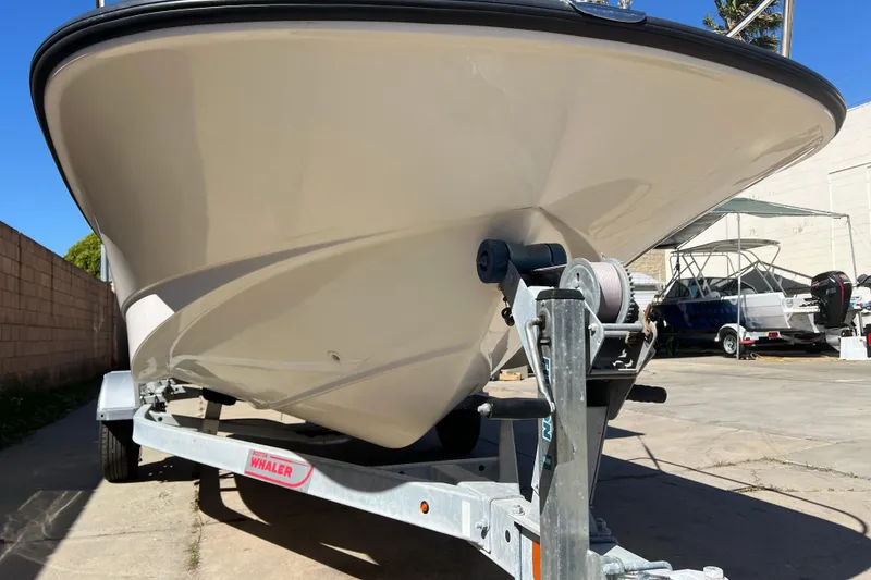 Slide: The Image of 2016 Boston Whaler 170 Montauk boat on trailer, viewed from the front. - 20