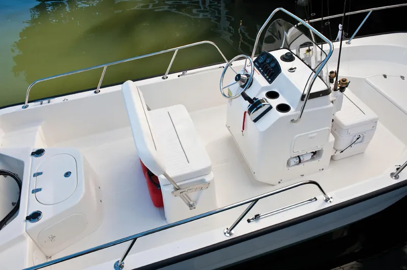 Slide: The Image of Manufacturer Provided Image: 2016 Boston Whaler 170 Montauk boat interior with seating and console. - 25
