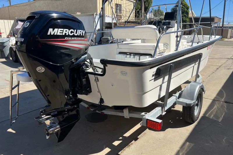 Slide: The Image of 2016 Boston Whaler 170 Montauk boat with Mercury outboard motor on trailer. - 4