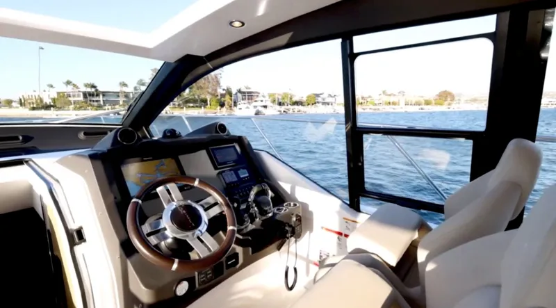 Slide: The Image of Azimut 51 Atlantis 2019 yacht on calm waters with coastal view. - 15